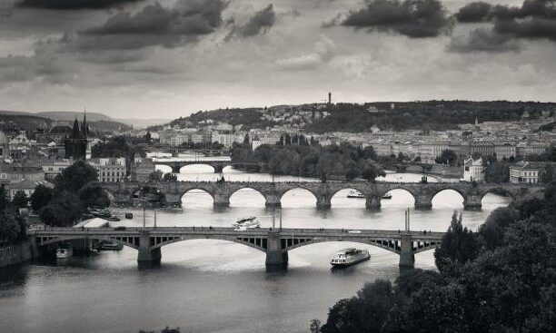 Prague skyline and bridge over river in Czech Republic.